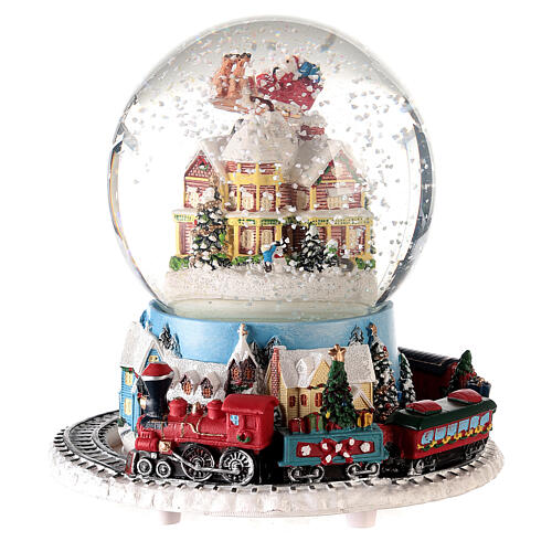Caixa de música globo de neve comboio, casa e Pai Natal no trenó, 16x16x16 cm
